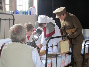Elliot, Phoebe and Alfie (our Durham Light Infantry Private) in role and being photographed by Cheshire Life